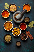 Various spices and herbs in bowls