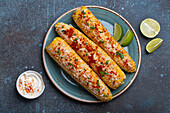 Elotes, grilled corn with cotija cheese (Mexico)