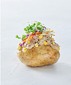 Baked potato with sour cream and vegetables