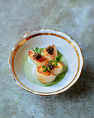 Scallops with caviar and purslane velouté