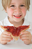 Boy Eating Jam on Toast