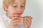 Boy Eating Jam on Toast