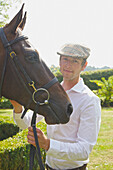 Man with Horse in Garden