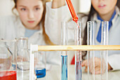 Schoolgirls Experimenting with Alkaline Acid pH at Chemistry Class