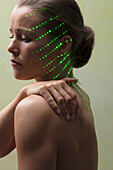 Woman Receiving Laser Therapy on Face and Neck