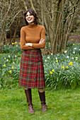 Smiling Woman Standing in Garden