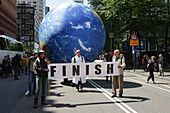 Environmental activists gather during march protest at the Zuidas financial district on May 31, 2024 in Amsterdam,Netherlands. Thousands of the environmental activists and supporters make a demonstration against the lobby of the large companies, their influence on politics, climate and ecological crisis and this consequences and demand a citizen's assembly for a just climate policy.