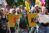 Environmental activists gather during march protest at the Zuidas financial district on May 31, 2024 in Amsterdam,Netherlands. Thousands of the environmental activists and supporters make a demonstration against the lobby of the large companies, their influence on politics, climate and ecological crisis and this consequences and demand a citizen's assembly for a just climate policy.