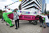 Environmental activists gather during march protest at the Zuidas financial district on May 31, 2024 in Amsterdam,Netherlands. Thousands of the environmental activists and supporters make a demonstration against the lobby of the large companies, their influence on politics, climate and ecological crisis and this consequences and demand a citizen's assembly for a just climate policy.