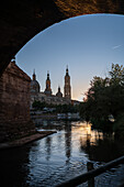 Cathedral-Basilica of Our Lady of the Pillar and the Ebro River bank at sunset, Zaragoza, Spain