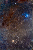 This is a portrait of the dust-filled region of sky in Taurus that frames the Hyades star cluster (at bottom) with bright yellow Aldebaran, up to the blue Pleiades star cluster (M45) at top. At left are the dense, dark brown Taurus Molecular Clouds catalogued by E.E. Barnard in the early 20th century with various B numbers such as B209 and B19.