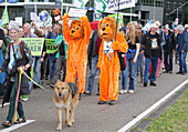 Environmental activists gather during march protest at the Zuidas financial district on May 31, 2024 in Amsterdam,Netherlands. Thousands of the environmental activists and supporters make a demonstration against the lobby of the large companies, their influence on politics, climate and ecological crisis and this consequences and demand a citizen's assembly for a just climate policy.