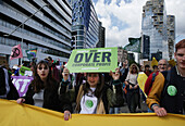 Environmental activists gather during march protest at the Zuidas financial district on May 31, 2024 in Amsterdam,Netherlands. Thousands of the environmental activists and supporters make a demonstration against the lobby of the large companies, their influence on politics, climate and ecological crisis and this consequences and demand a citizen's assembly for a just climate policy.