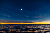 This is the total eclipse of the Sun over the waters of Lac Brome, in the Eastern Townships of Quebec, Canada, on April 8, 2024.