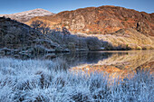 Freezing conditions at Llyn Dinas in winter, near Beddgelert, Snowdonia National Park (Eryri), North Wales, United Kingdom, Europe