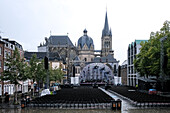 Katschhof, a tree-filled square, location of festivals and markets, with the iconic Aachen Cathedral, one of the oldest cathedrals in Europe behind, Aachen, North Rhine Westphalia, Germany, Europe