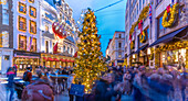 View of New Bond Street Christmas tree and shops at Christmas, Westminster, London, England, United Kingdom, Europe