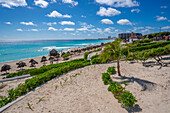 View of long white sandy beach at Playa Delfines, Hotel Zone, Cancun, Caribbean Coast, Yucatan Peninsula, Mexico, North America