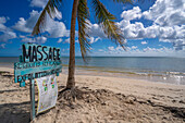 View of rustic massage sign on beach near Puerto Morelos, Caribbean Coast, Yucatan Peninsula, Mexico, North America