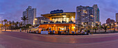 View of promenade restaurant and hotels from New Pier at dusk, Durban, KwaZulu-Natal Province, South Africa, Africa