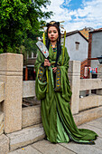 Traditionally dressed woman in the historic center of Zhangzhou, Fujian, China, Asia