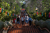 Visitors and tourists on steps at Wat Suthep (Wat Phra That Doi Suthep), historical Buddhist temple, in the forest above Chiang Mai, Thailand, Southeast Asia, Asia