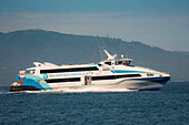 The 38 metre Majestic Kawanua II aluminium fast ferry departing the capital to the distant northern island of Siau, Manado, North Sulawesi, Indonesia, Southeast Asia, Asia