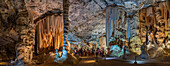 View of visitors viewing stalagmites and stalactites in the interior of Cango Caves, Oudtshoorn, Western Cape, South Africa, Africa