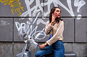 Italy, Campania, Naples, historical centre listed as World Heritage by UNESCO, young Italian women on a bike