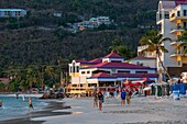 West Indies, British Virgin Islands, Tortola Island, on Cane Garden Bay's last end-of-day bathing beach, in the background the famous Quitos bar