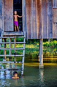 Cambodia, Kompong Thom province, Kompong Thom or Kampong Thom, traditional stilt house in flooded village