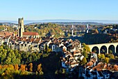 Switzerland, Canton of Fribourg, Fribourg, the fortifications, San Nicolas Cathedral and Zaehringen Bridge (Zähringerbrücke) and Hoya bridge in the background over Sarine River (Saane River)