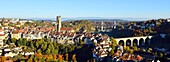 Switzerland, Canton of Fribourg, Fribourg, the fortifications, San Nicolas Cathedral and Zaehringen Bridge (Zähringerbrücke) and Hoya bridge in the background over Sarine River (Saane River)