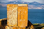 Armenia, Gegharkunik region, Hayravank, the 9th and 10th centuries Hayravank monastery built on a rocky promontory overlooking Sevan Lake, khatchkars (carved memorial steles)