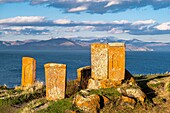 Armenia, Gegharkunik region, Hayravank, the 9th and 10th centuries Hayravank monastery built on a rocky promontory overlooking Sevan Lake, khatchkars (carved memorial steles)