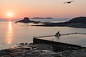 France, Ille et Vilaine, Saint Malo, Bon Secours beach, diving board and seawater swimming pool at sunset