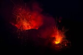 Italy, Sicily, Eolian Islands, Tyrrhenian sea, San Vincenzo, summit of Stromboli volcano 924 m, eruption of lava and projection of volcanic bombs from the central craters