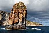 Italy, Sicily, Aeolian Islands, listed as World Heritage by UNESCO, Lipari Island, the cliffs of the south coast of the island, Lipari Faraglioni, rock of solidified magma from a volcanic plug called Pietra Lunga (Long Stone)