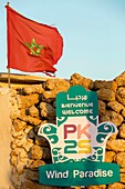 Marocco, Oued Ed-Dahab, Dakhla, PK25 Resort, Moroccan flag at the entrance of an eco-lodge