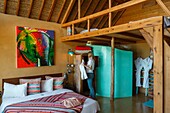 Marocco, Oued Ed-Dahab, Dakhla, West Point Resort, young woman in a hotel room of an eco-lodge