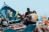 Marocco, Oued Ed-Dahab, Dakhla, Lassarga, fishermen preparing their fishing nets on the beach