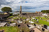 Ireland, County Fingal, Dublin's northern suburbs, Howth, former Saint Mary's church and cemetery, at the bottom the port and lighthouse of the city