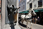 Belgium, West Flanders, Bruges, southern part of the historic center listed as a UNESCO World Heritage, Wijngaardplein square, horse-drawn carriage passing in front of the Fountain of Horses