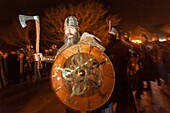 United Kingdom, Scotland, Shetland Islands, Mainland, Lerwick, Up Helly Aa festival, squad of Guizers parading to the site where the viking longship will be set on fire