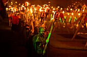 United Kingdom, Scotland, Shetland Islands, Mainland, Lerwick, Up Helly Aa festival, squad of Guizers parading to the site where the viking longship will be set on fire