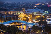 Georgia, Tbilisi, panorama over the city, Bridge of Peace over the Koura river and the Public Service Hall on the background