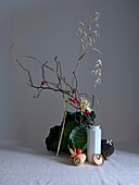 A tasteful arrangement featuring savoy cabbage, a black radish, and tiny red crab apples, enhancing the artistic allure of this still life set against a neutral background.