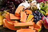 assorted exotic fruits pumpkin kiwifruit grapes coconut raspberries