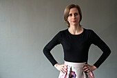 Tilburg, Nethgerlands. Studio portrait of a young adult caucasian woman wearing a colorfull skirt.