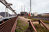 Huge, heavy steel production plant and industry terrain, producing various kinds of steel inside an CO2 Emitting and Exhausting Factory. IJmuiden, Netherlands.